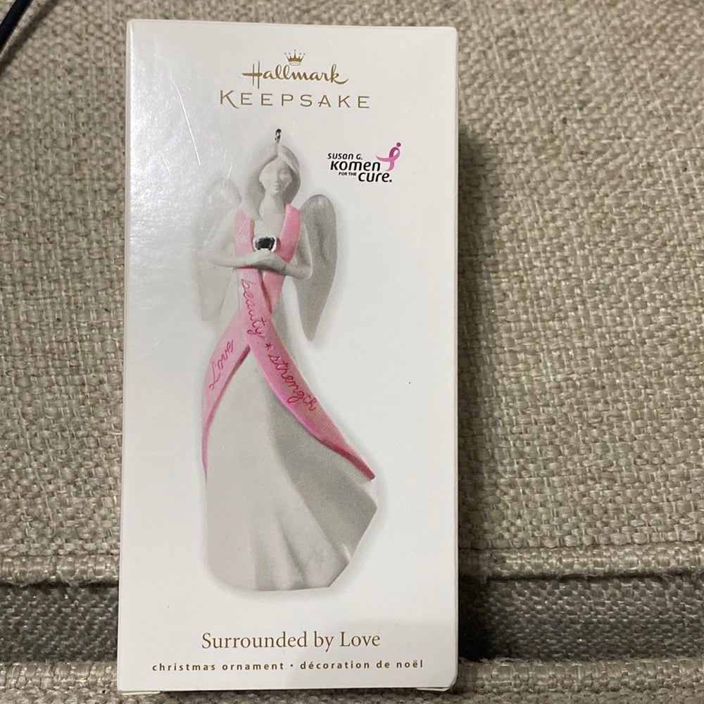 2010 Hallmark keepsake ornament. “Surrounded by love”. Susan G. Komen Angel.